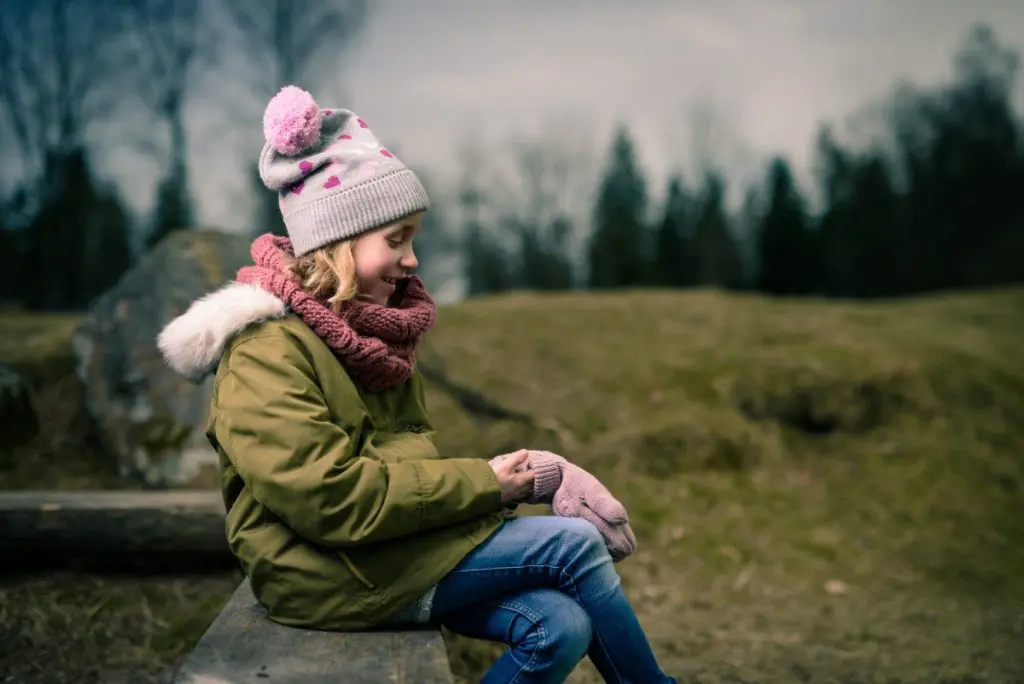 child outdoor in cold winter