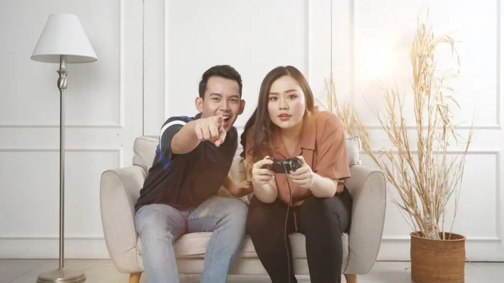 couple playing console fun game