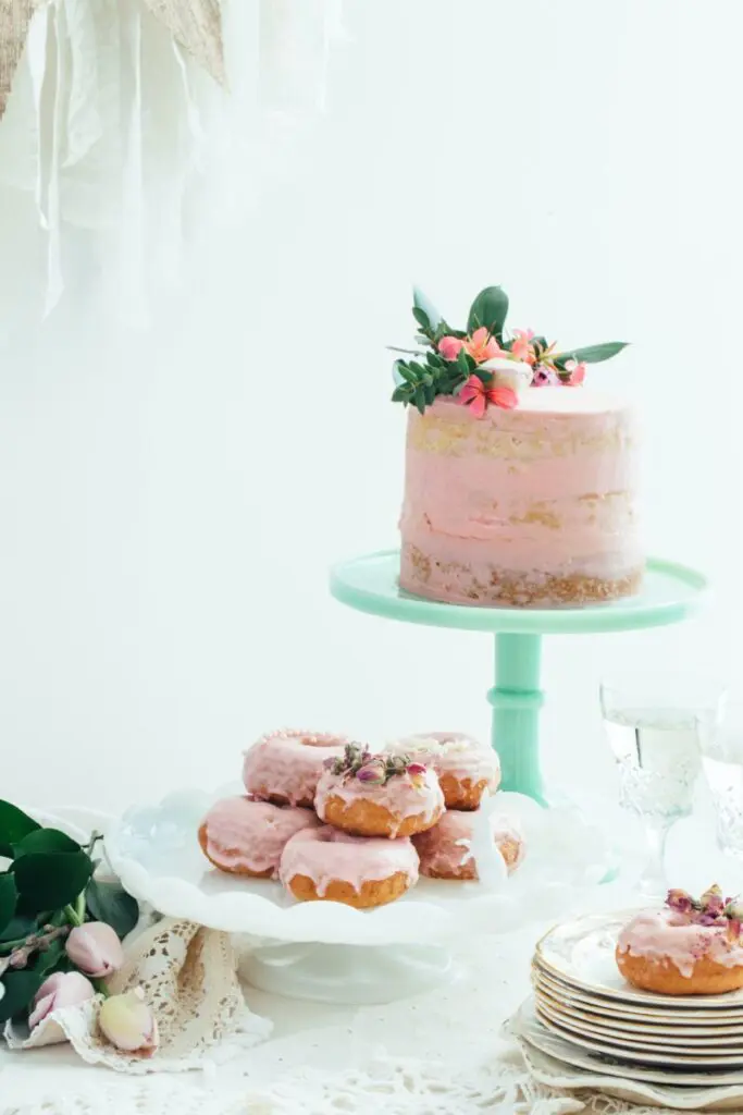 70th Birthday Invitations: pink cake and pink doughnuts