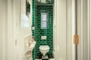 small bathroom design with green tiles