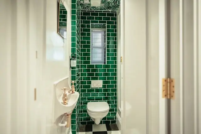 small bathroom design with green tiles