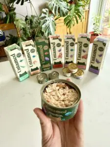 Untamed cat food boxes and can
