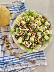 Galia melon salad with feta and pistachio Galia melon salad with feta and pistachio on plate