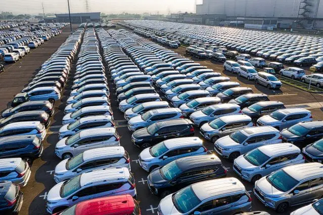 Parking lot outside car manufacturer holding thousands of brand new cars Parking lot outside car manufacturer holding thousands of brand new cars