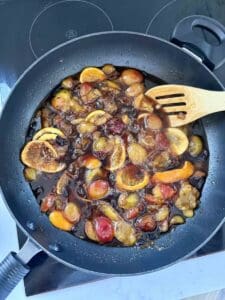 plum conserve ingredients in pan cooking