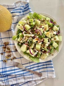 Galia melon salad with feta and pistachio on plate
